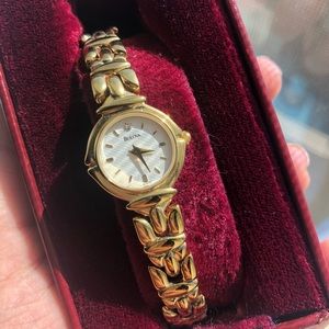 gold Bulova watch